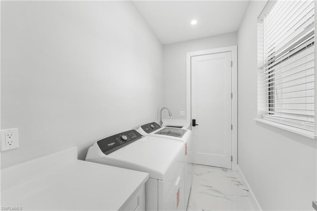Laundry area with utility sink and ample counter space