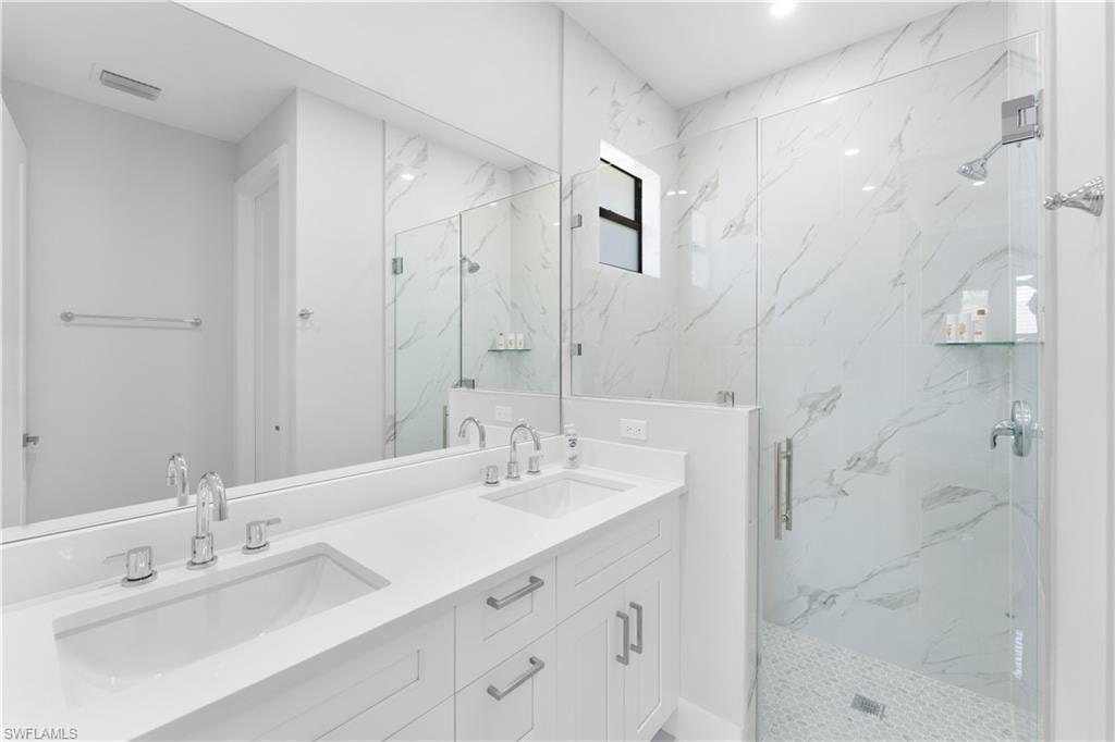 Double vanity with integrated sinks and chrome fixtures