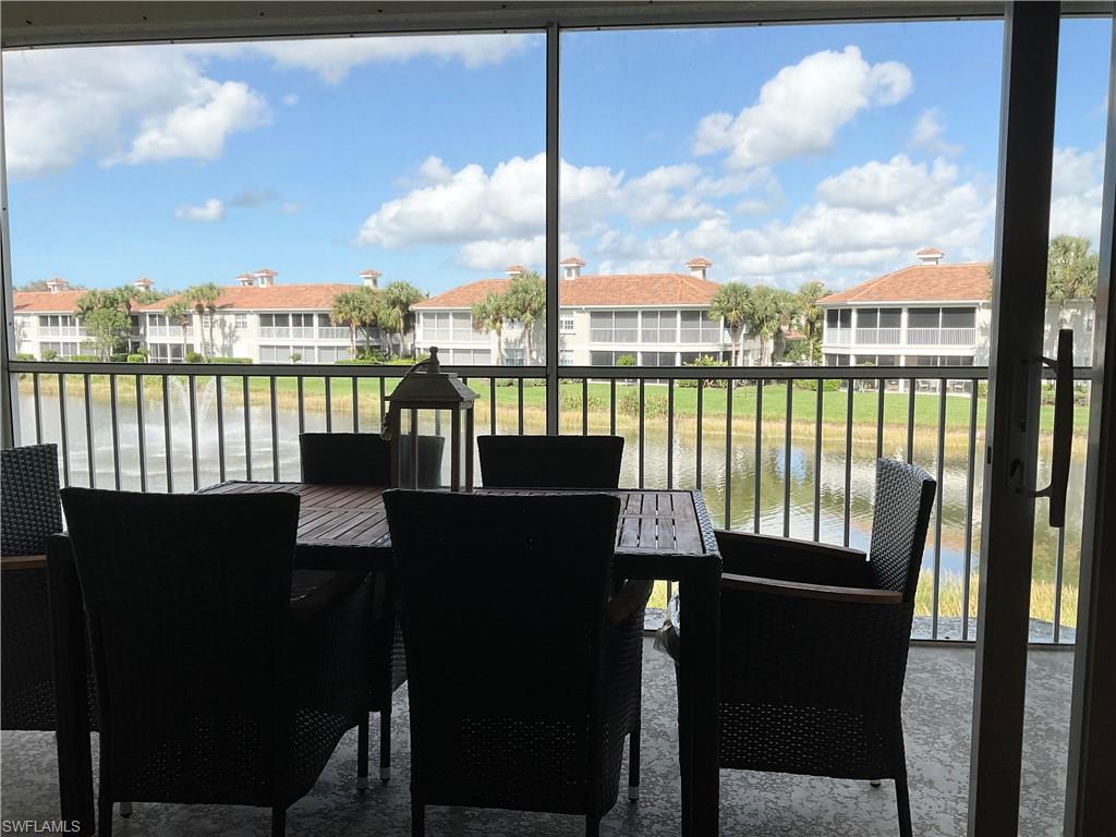 Lanai featuring view of lake and water view