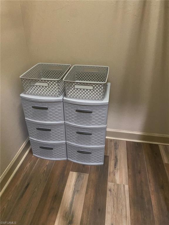 Guest bedroom has walk-in closet with storage drawers