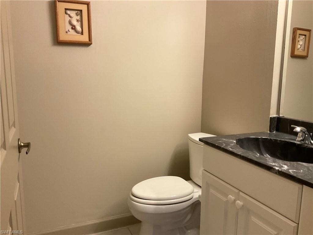 Guest Half-Bathroom with vanity, and toilet