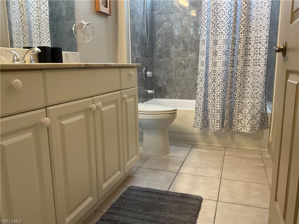 Guest Full bathroom with shower / bath combo, toilet and vanity