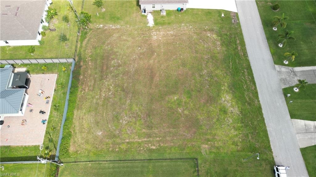 Expansive undeveloped parcel featuring partial perimeter fencing