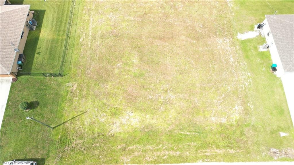 Expansive grassy lot with clear boundaries