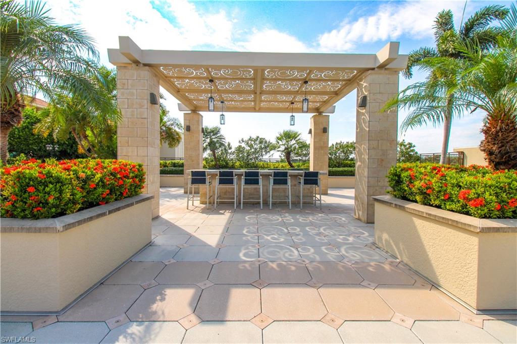 View of patio / terrace with exterior bar and a pergola