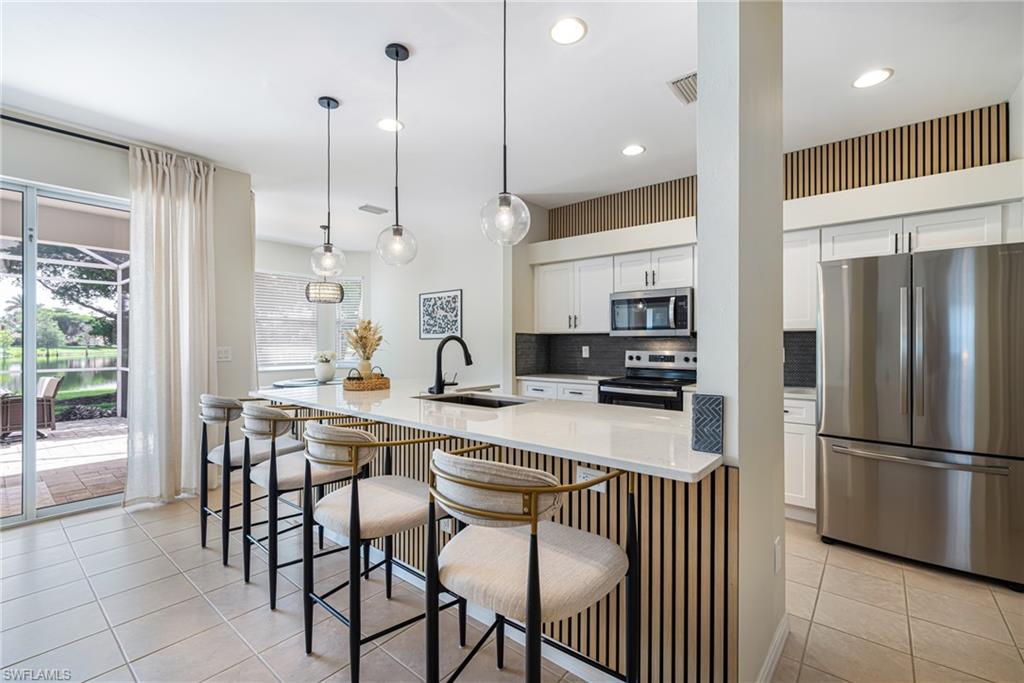 Gorgeous custom wood panels, upgrades lighting fixtures, and rich luxurious updates