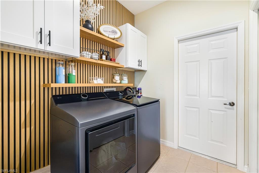 Stylish Laundry room with access to your air conditioned garage.