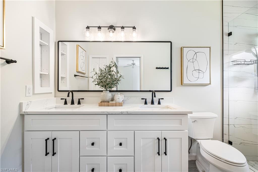 Beautifully renovated master bath with his/hers double sinks