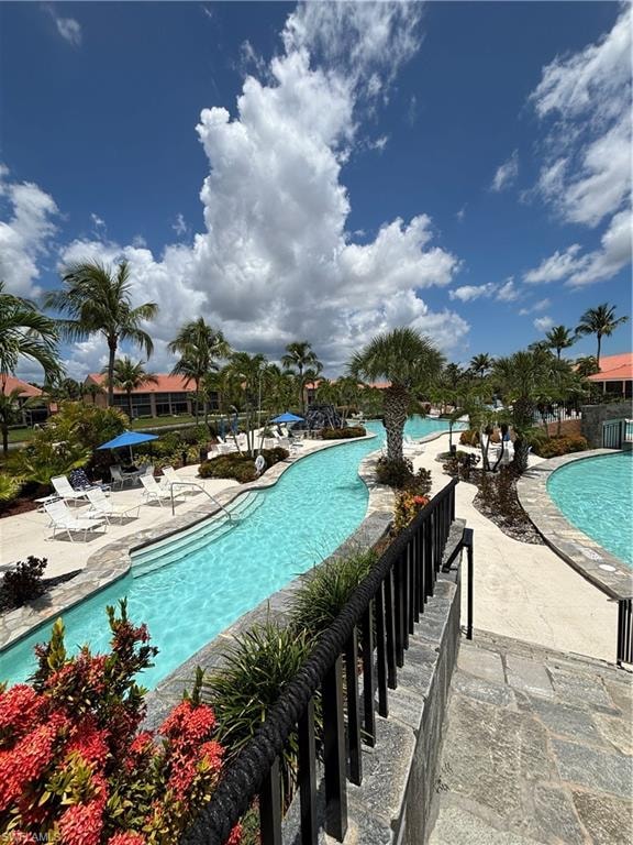 Community pool with a patio area