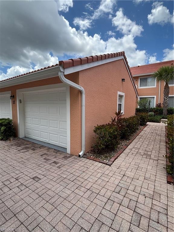 View of detached garage with window