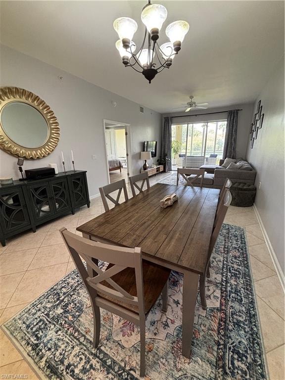Dining area featuring a wood-finish dining table with seating for six, tile flooring, a chandelier, and console
