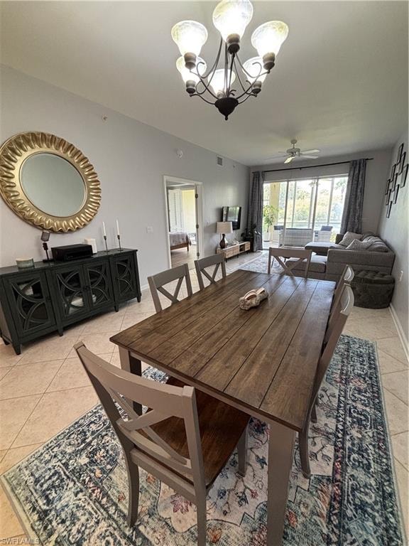 Open-concept dining area with tile flooring and a multi-light chandelier