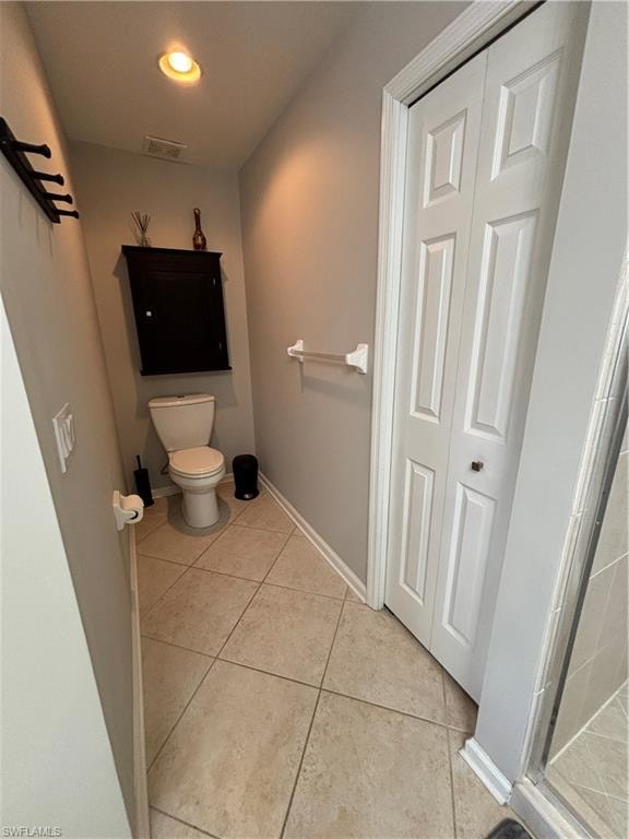 Compact bathroom featuring neutral-toned wall paint and diagonal tile flooring