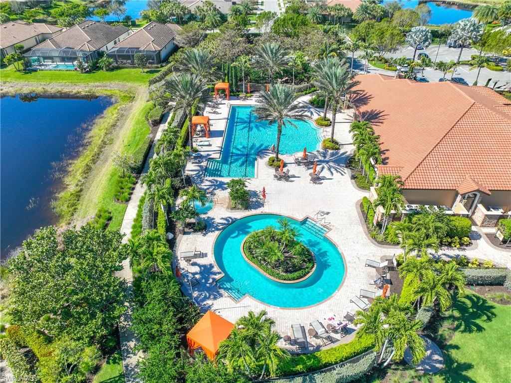 Drone / aerial view of a pool and a large body of water