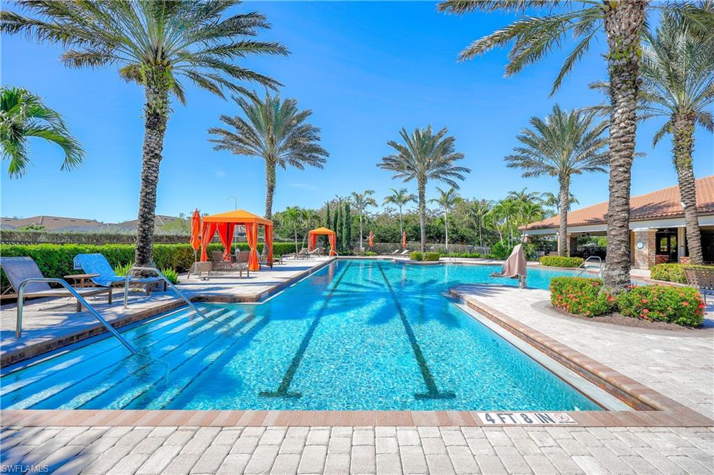 Community pool with a patio