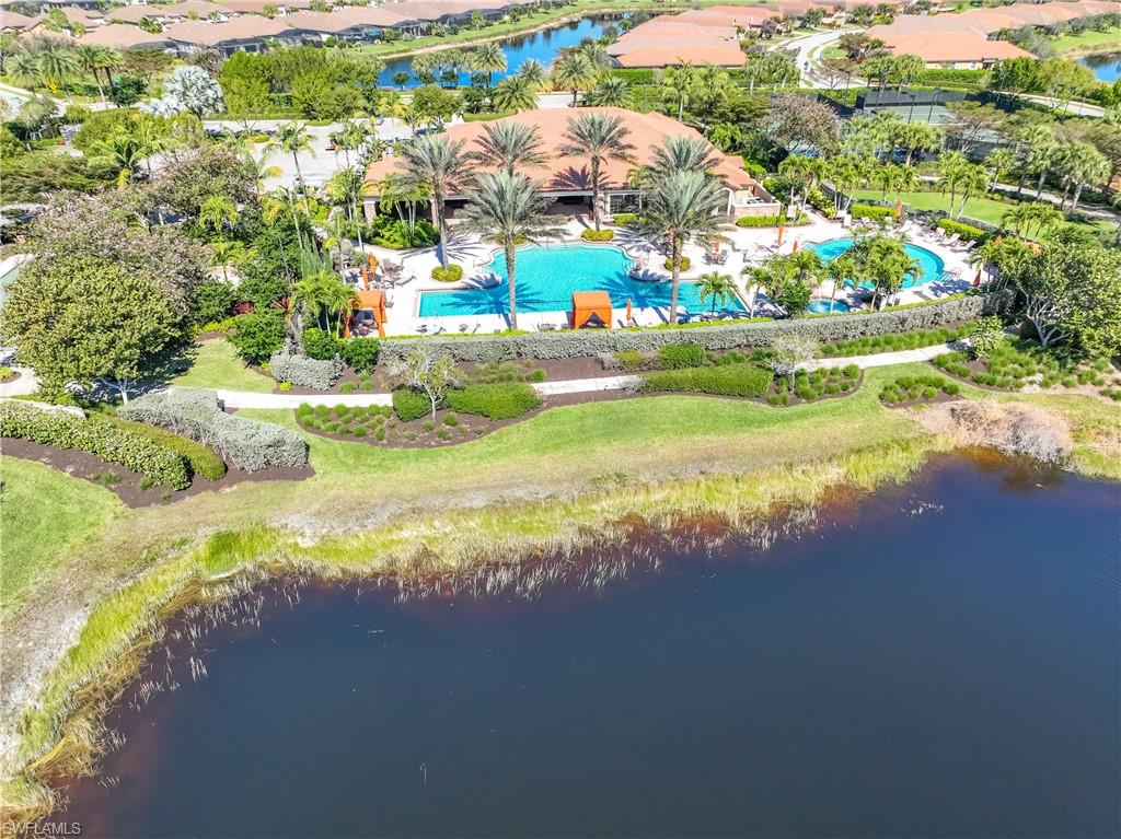 Drone / aerial view of a large body of water and a pool