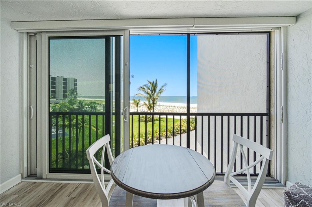 Sliding glass doors opening to a screened balcony