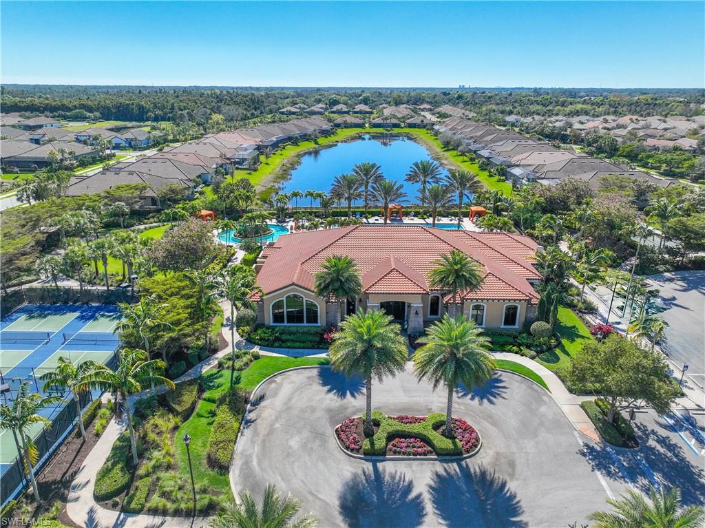 Aerial view of residential area featuring a large body of water