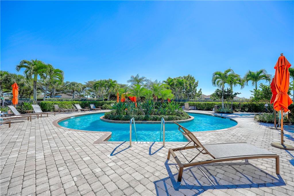 Community pool with a patio