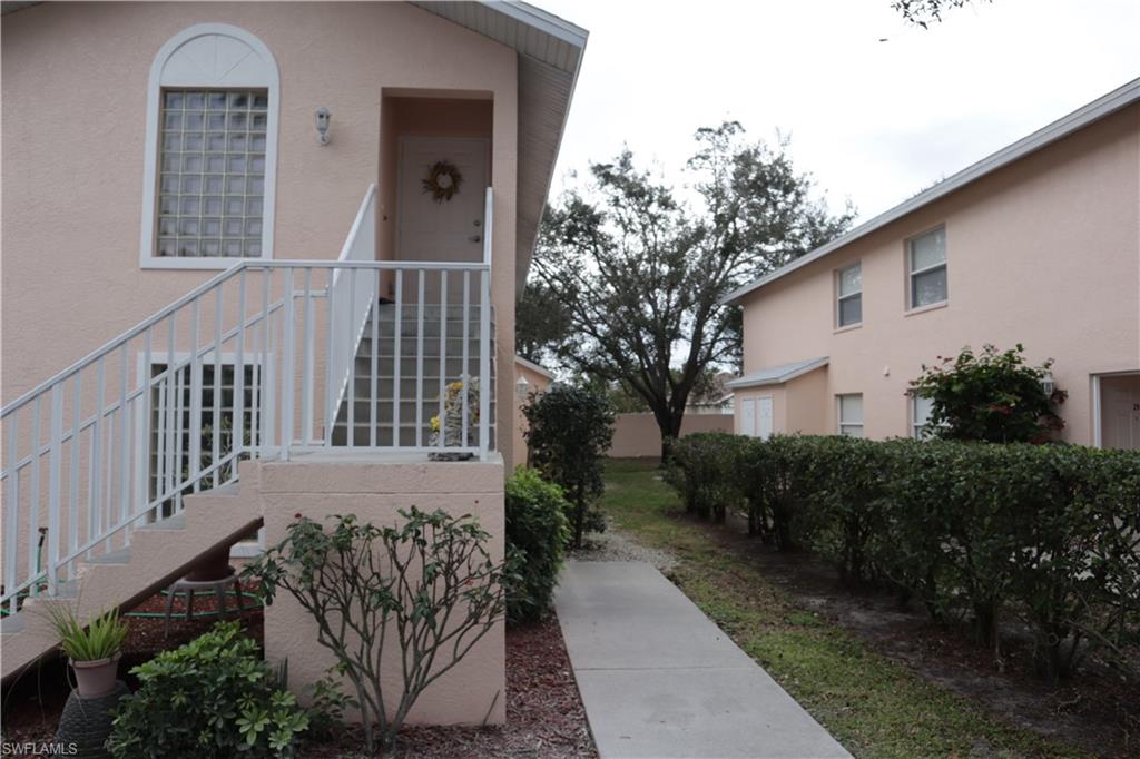 Doorway to property with stucco siding