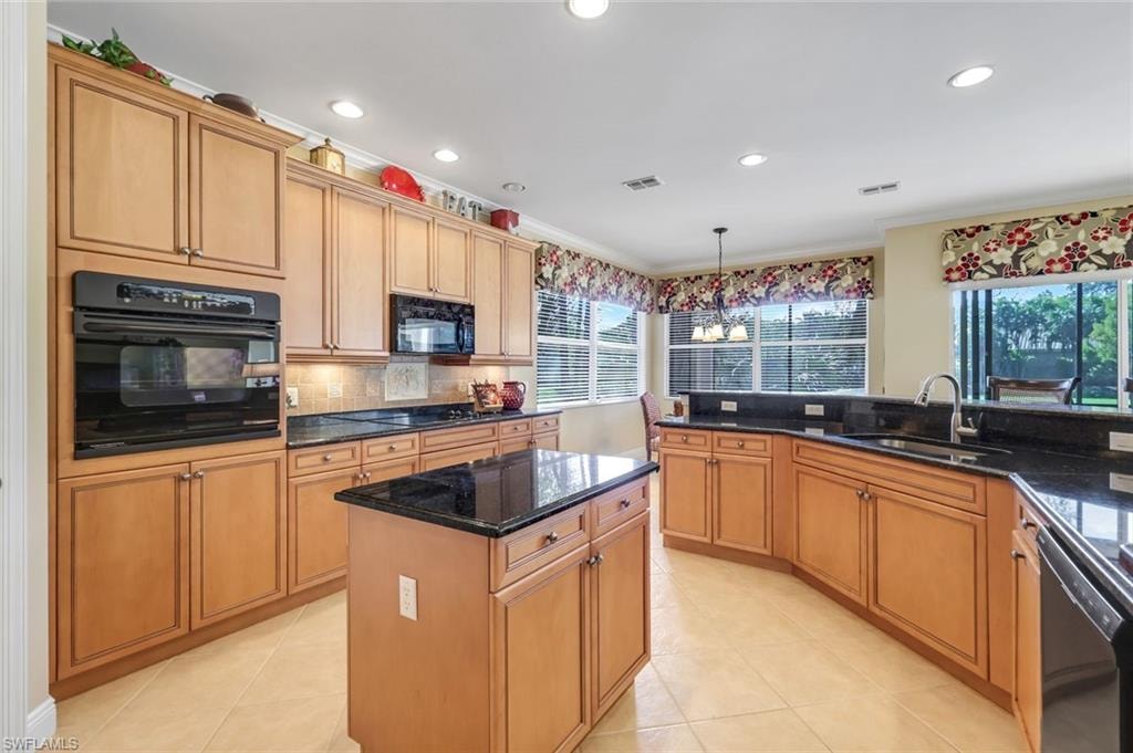 Wood cabinetry and granite counters.