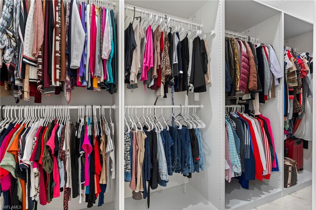 This picture doesn't make justice to the largest custom-made walk-in closet with California-style cabinetry