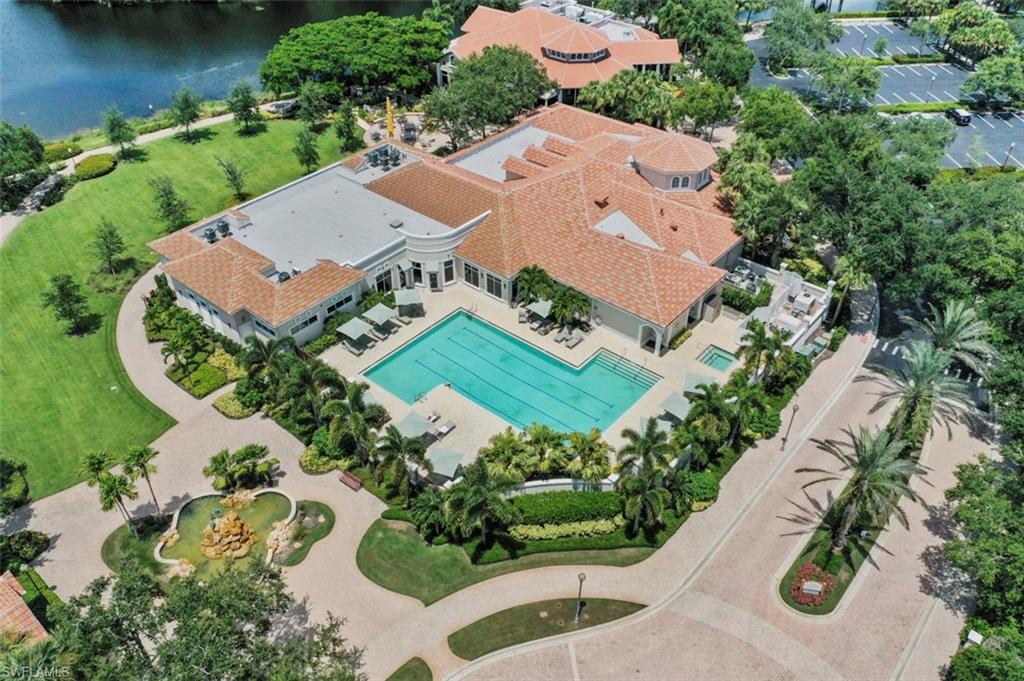 Birds eye view of property with a water view