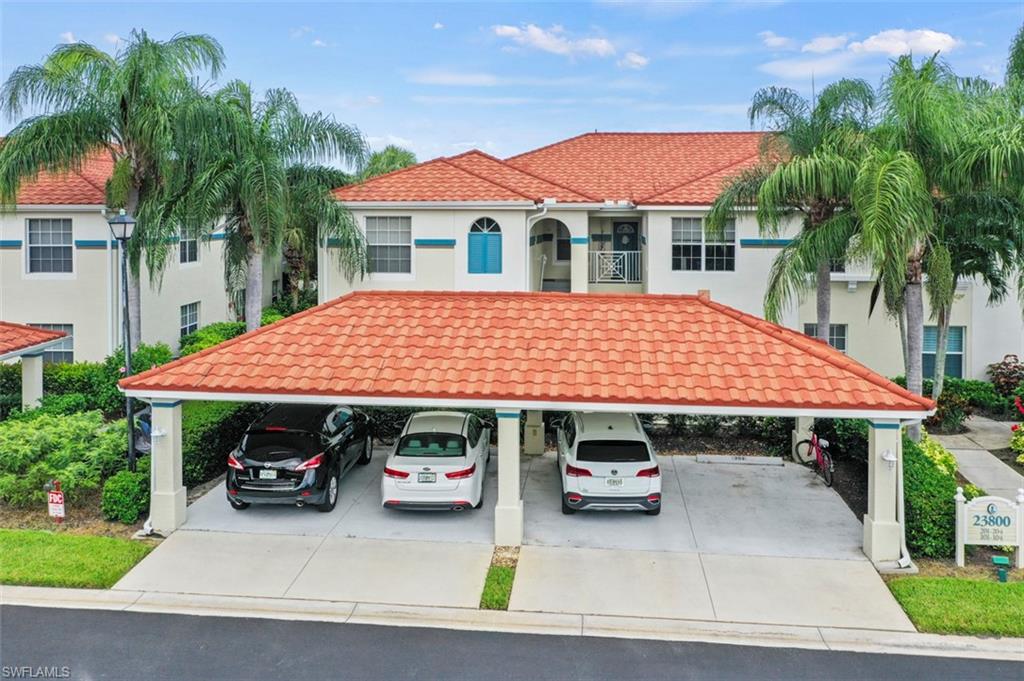 Mediterranean / spanish-style house with a carport