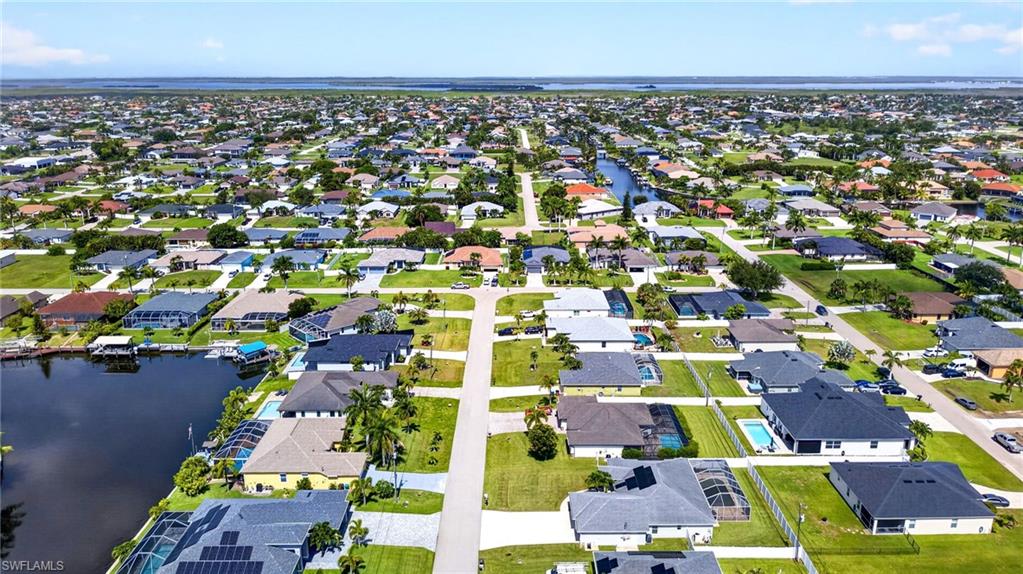 Aerial perspective showcasing a residential community with numerous properties