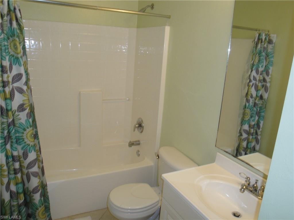 Guest bath with dual shower and tub.