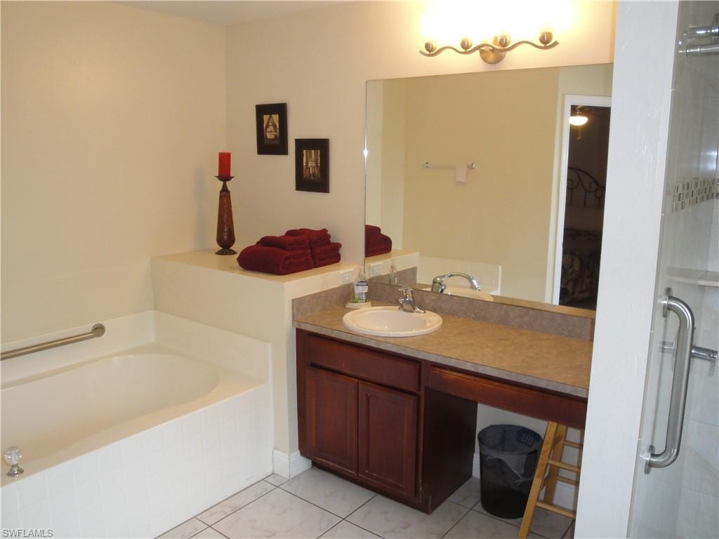 Master bath with tub and separate shower.