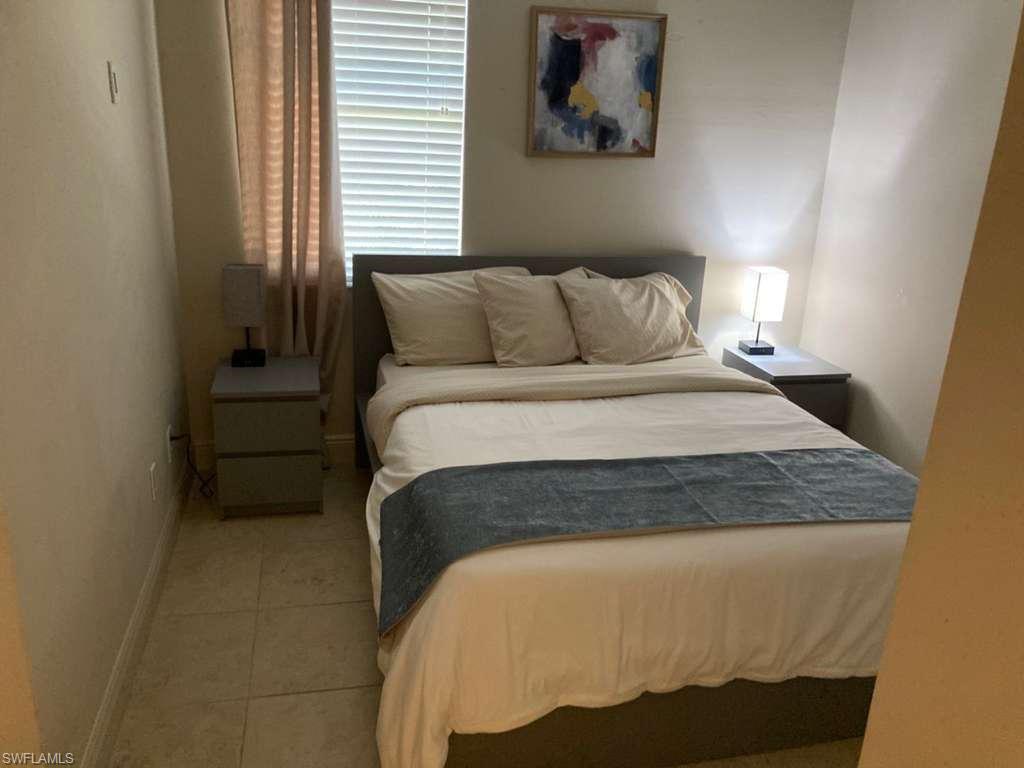 Bedroom featuring neutral-toned walls and tile flooring