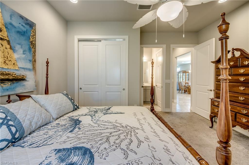 Carpeted room with light neutral wall paint and white baseboards