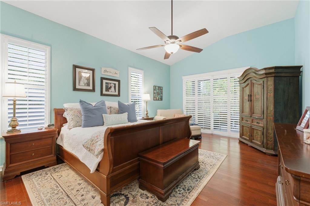 Vaulted ceilings featuring a ceiling fan with integrated lighting