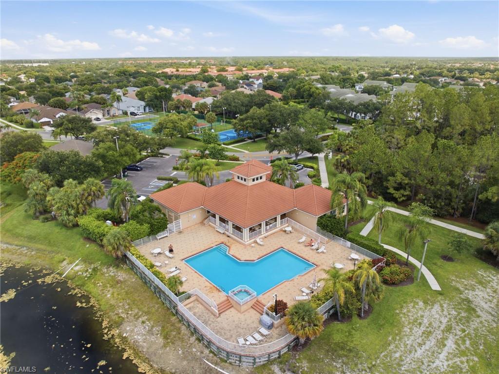 Community clubhouse featuring a swimming pool, spa, and sundeck