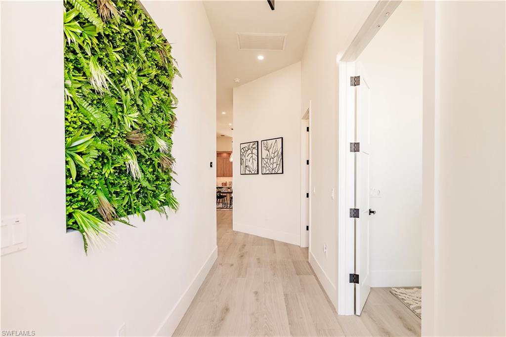 Hallway entrance with volume ceilings