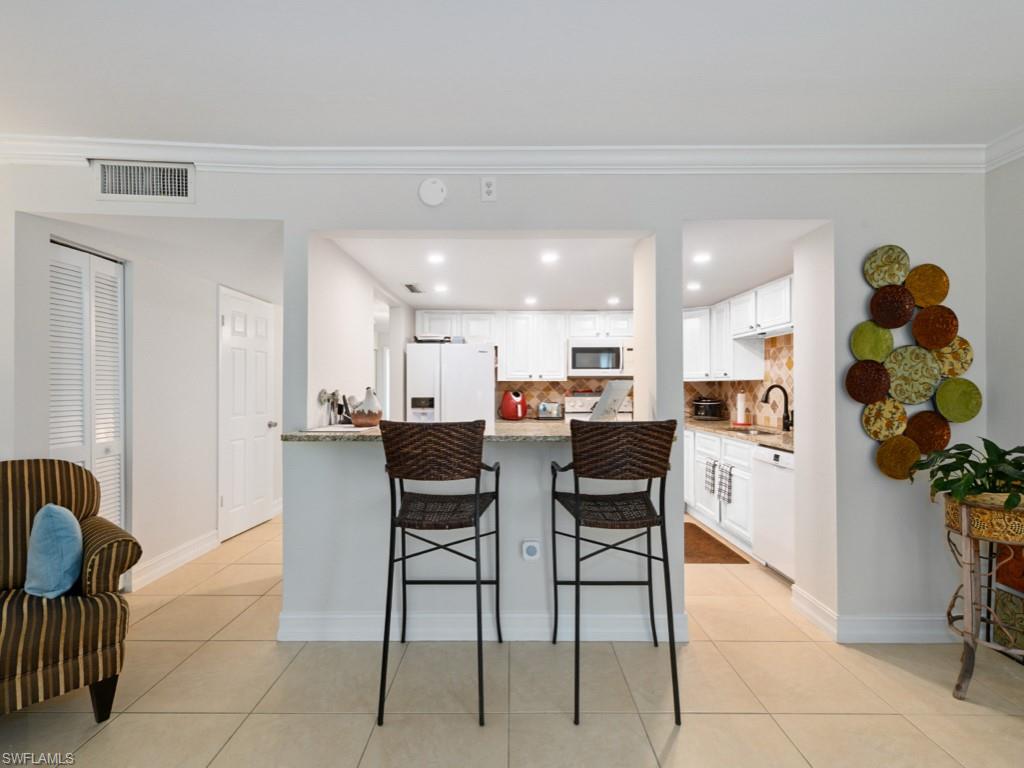 Cabinets were virtually staged white.  Cabinets were replaced with new white cabinets