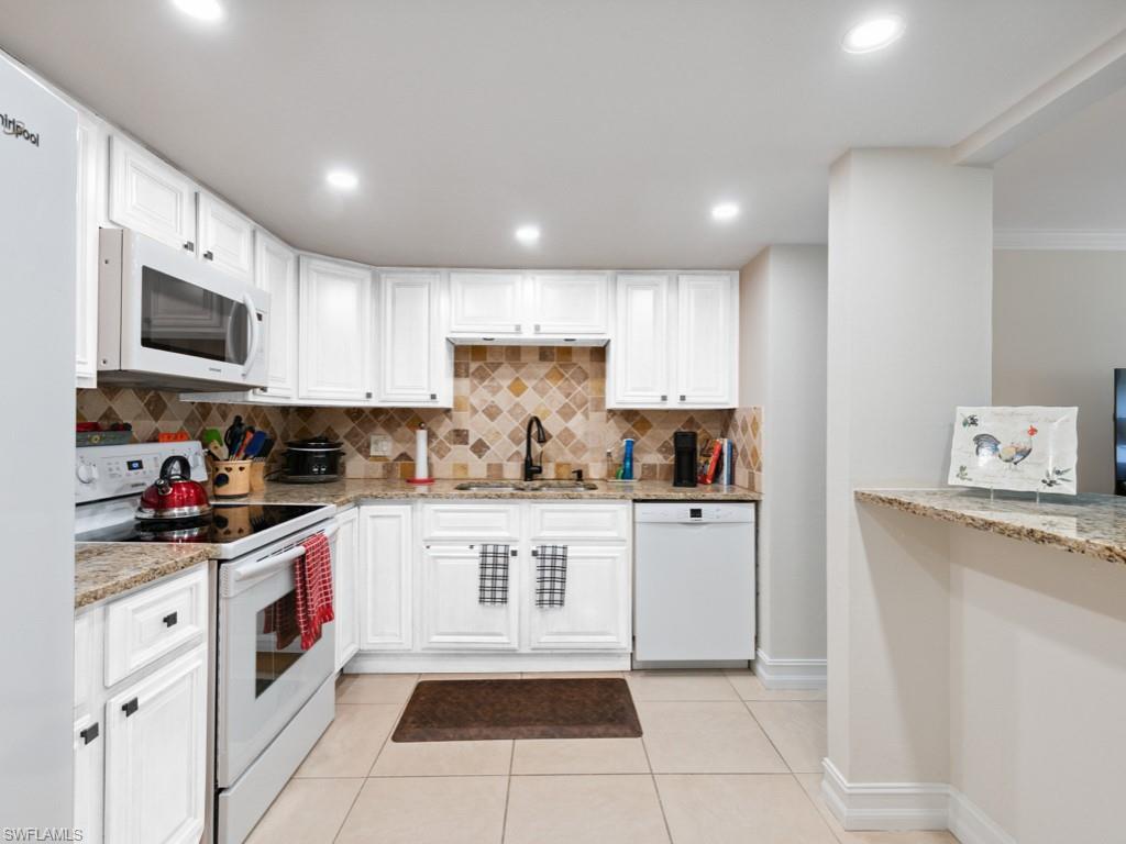 Cabinets were virtually staged white.  Cabinets were replaced with new white cabinets