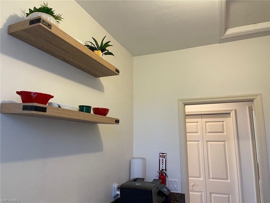 Half Bathroom with Lots of Cabinetry, Countertops, Wash Sink, Full Sized Washer and Dryer.