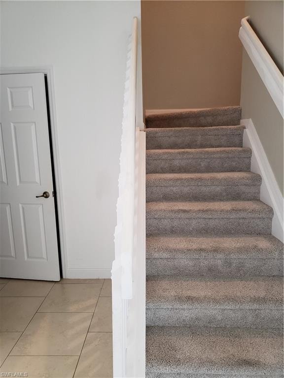 Up the carpeted stairs to the bedroom and bonus room