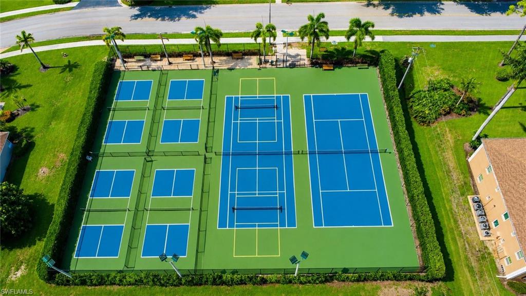 Recreational court area featuring multiple pickleball courts and tennis courts