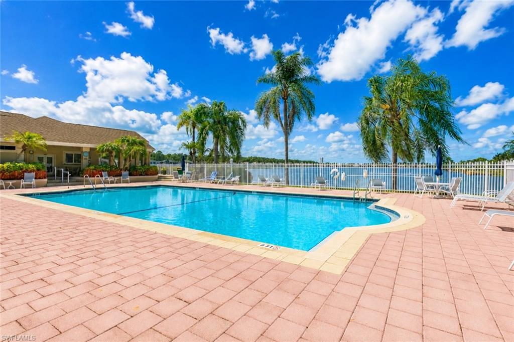 Outdoor swimming pool featuring a curved edge and integrated steps