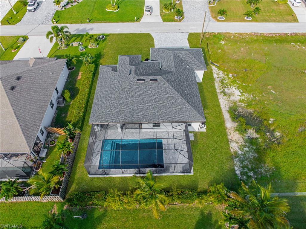 View of subject property featuring a pool