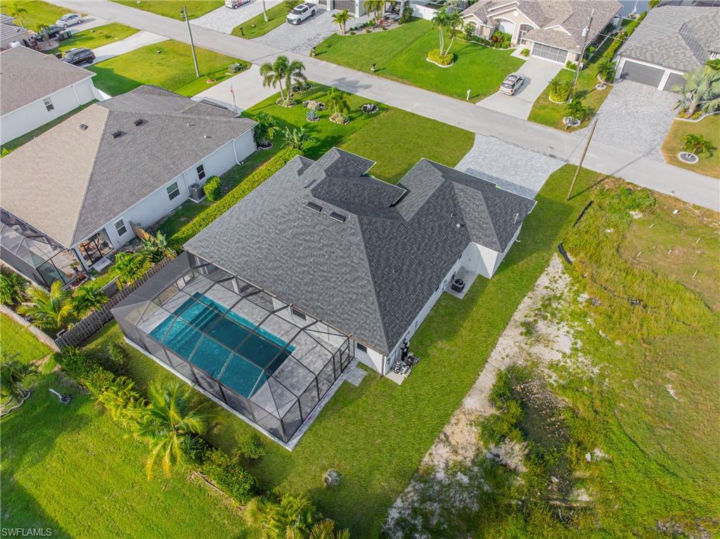 Aerial view of residential area featuring a pool area