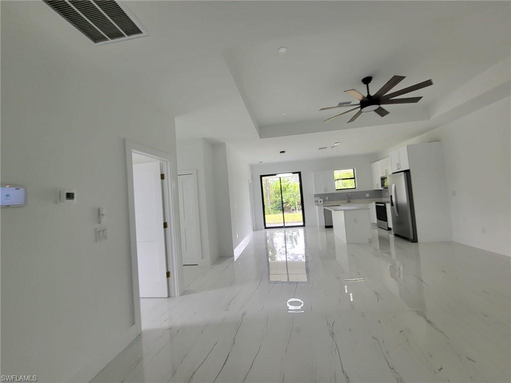 patterned flooring and ceiling fan