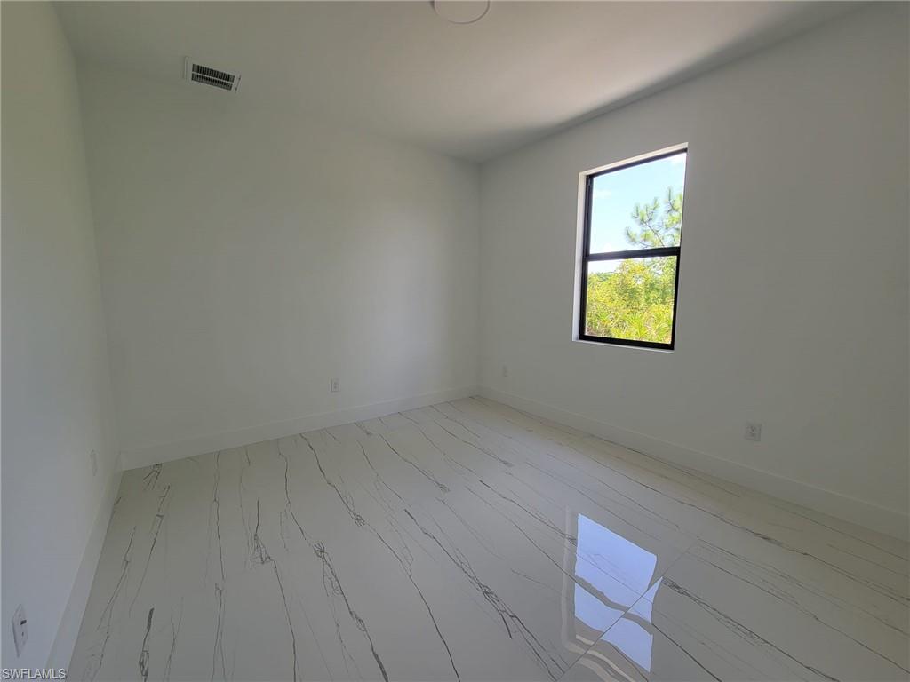 Unfurnished room featuring light wood-type flooring