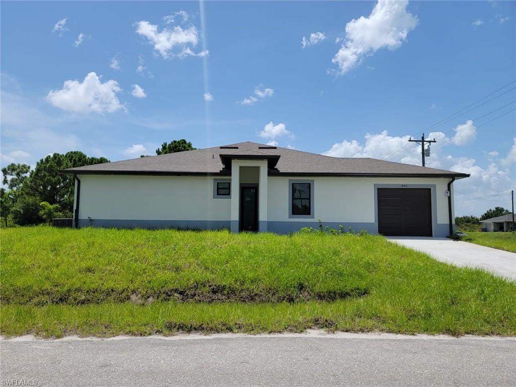View of front facade featuring a garage
