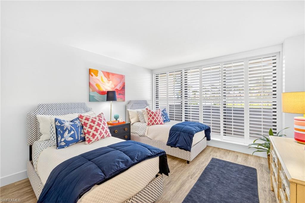 Bedroom with access to lanai and Gulf views