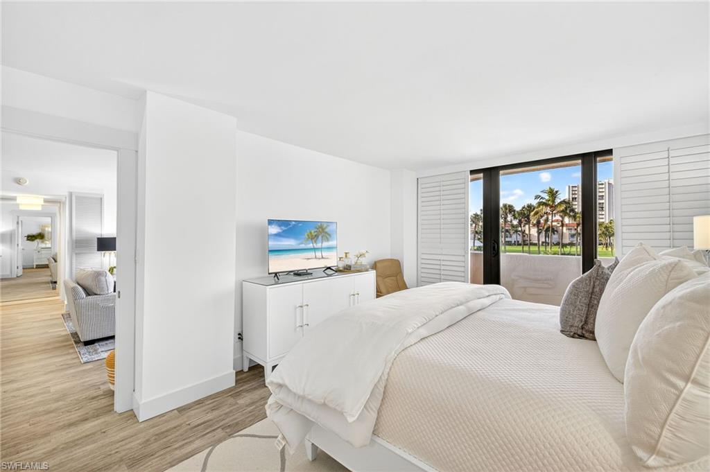 Bedroom featuring light wood-type flooring and access to outside