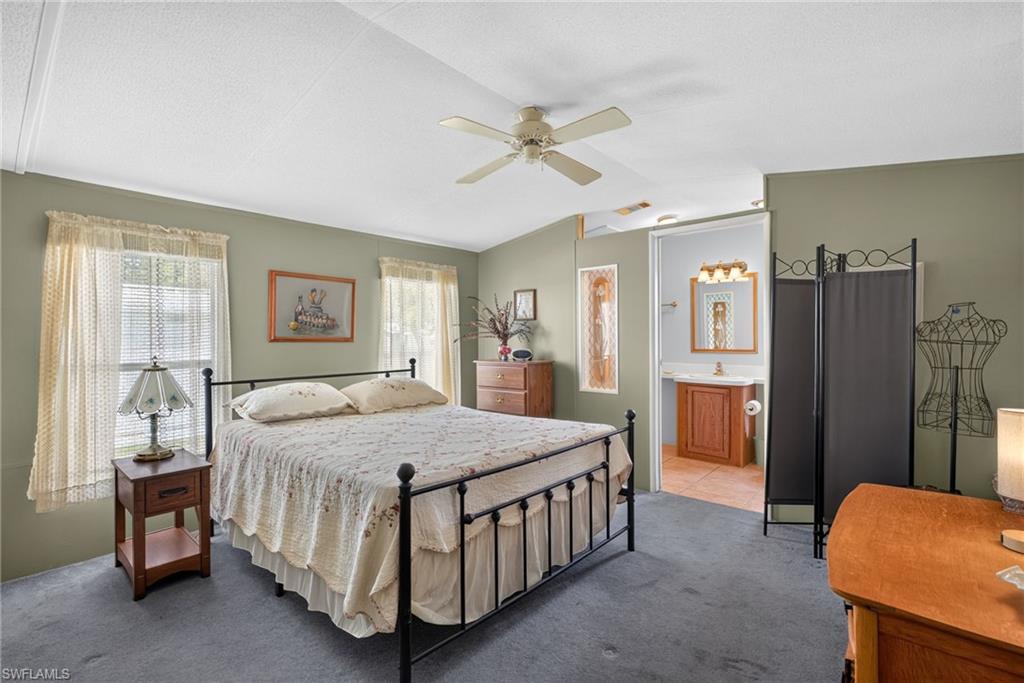 Bedroom featuring carpet flooring and a ceiling fan